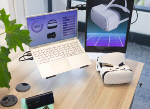 Bureau avec ordinateur portable affichant des graphiques et une tec